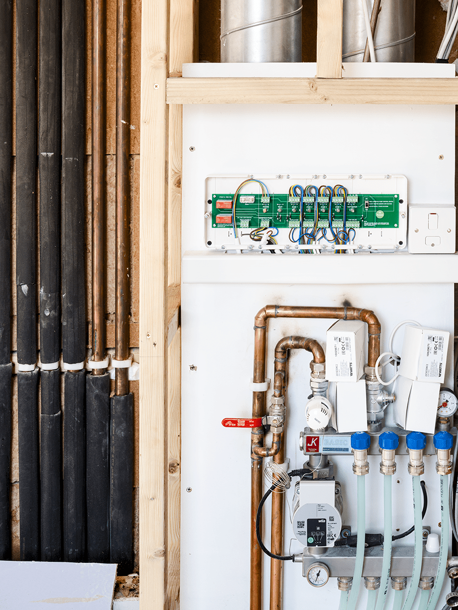 Riser with MVHR and underfloor heating manifold.